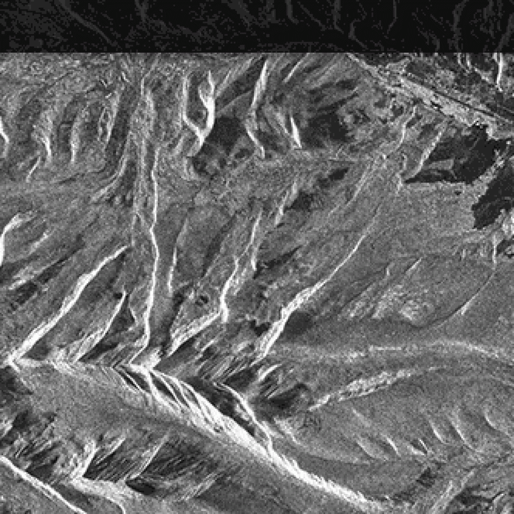 PALSAR images of the Rocky Mountains before and after terrain 
correction. Extreme layover is corrected as the mountains are made to stand up. ASF DAAC 2014; Includes Material © JAXA/METI 2007.