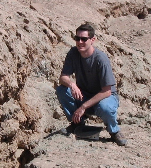 Photo of Matt Pritchard along sharp rupture at south end of Salar del Carmen fault.